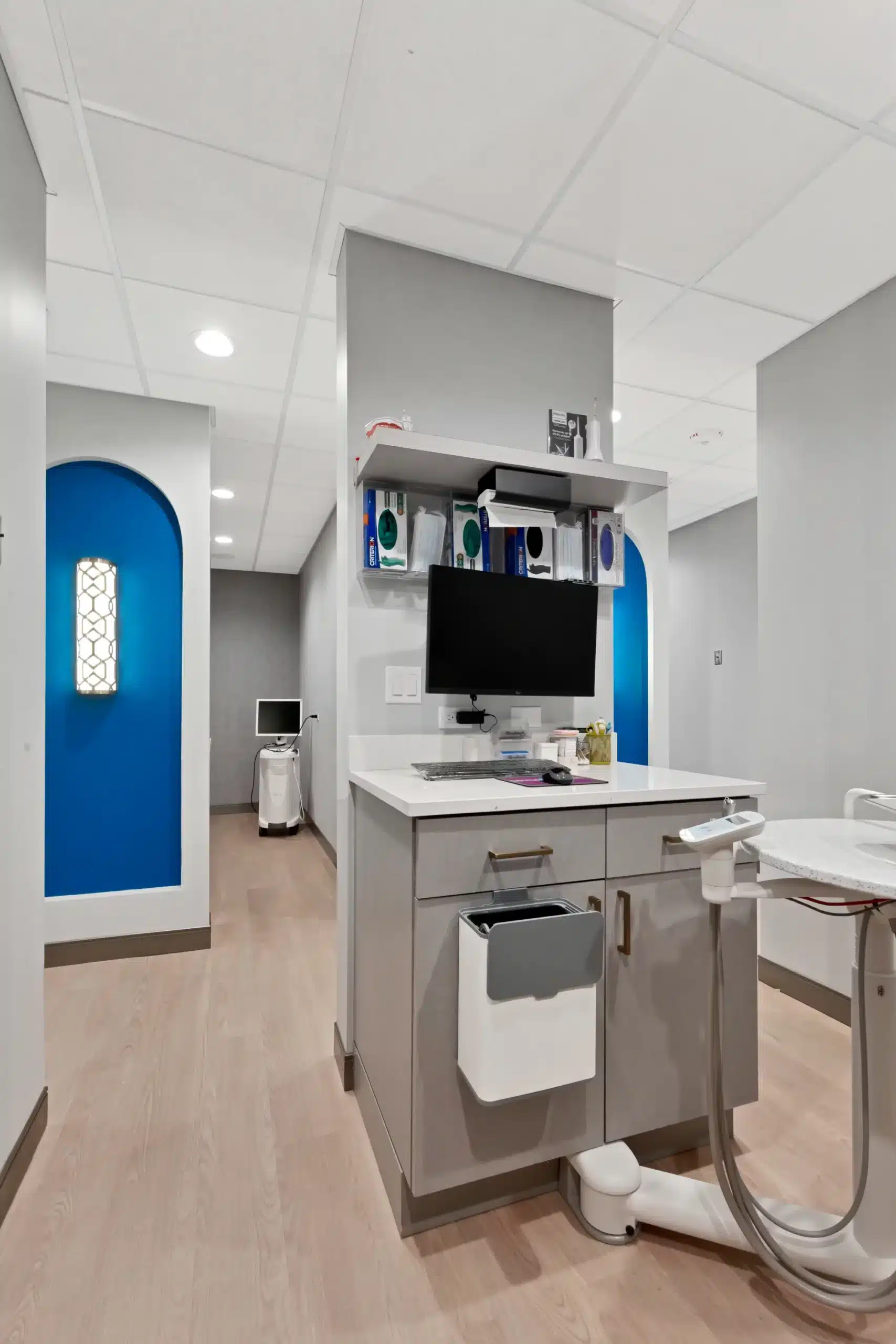 Treatment room work area with monitor and storage