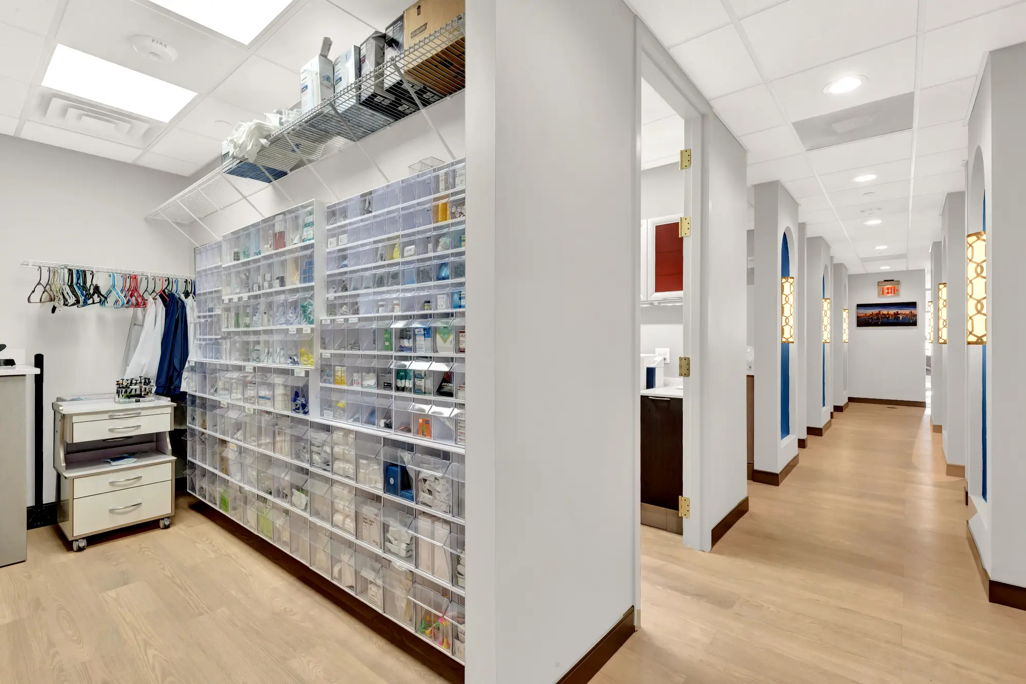 Supply room with organized shelving of dental supplies