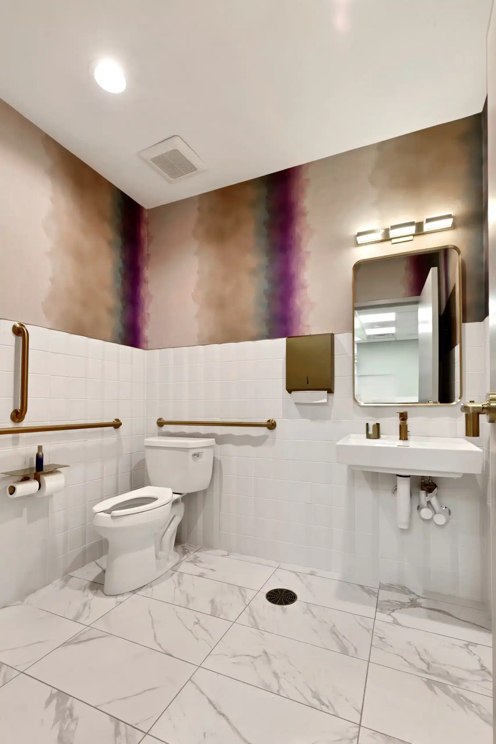 Accessible restroom with toilet, sink and grab bars
