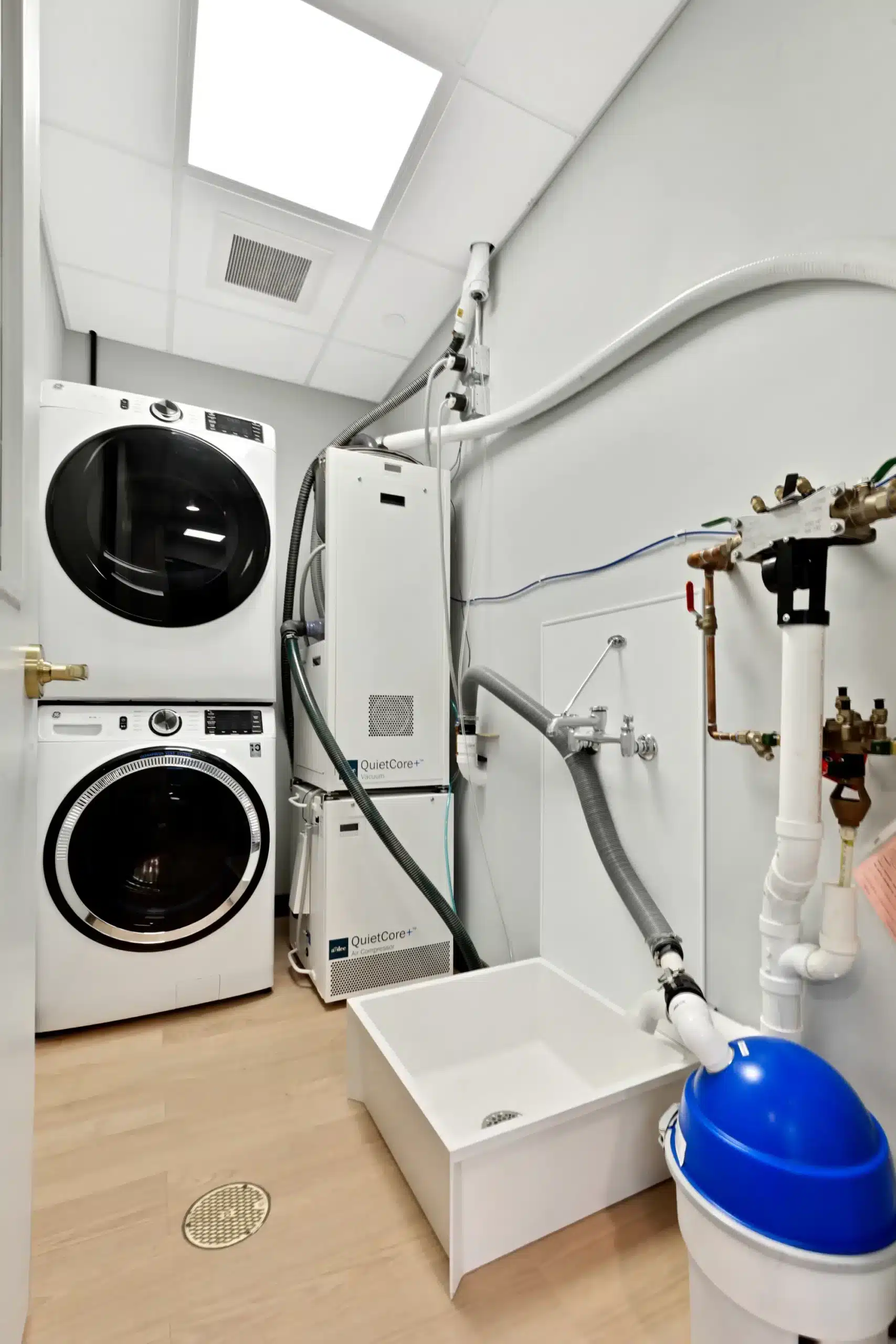 Laundry room with stacked washer and dryer
