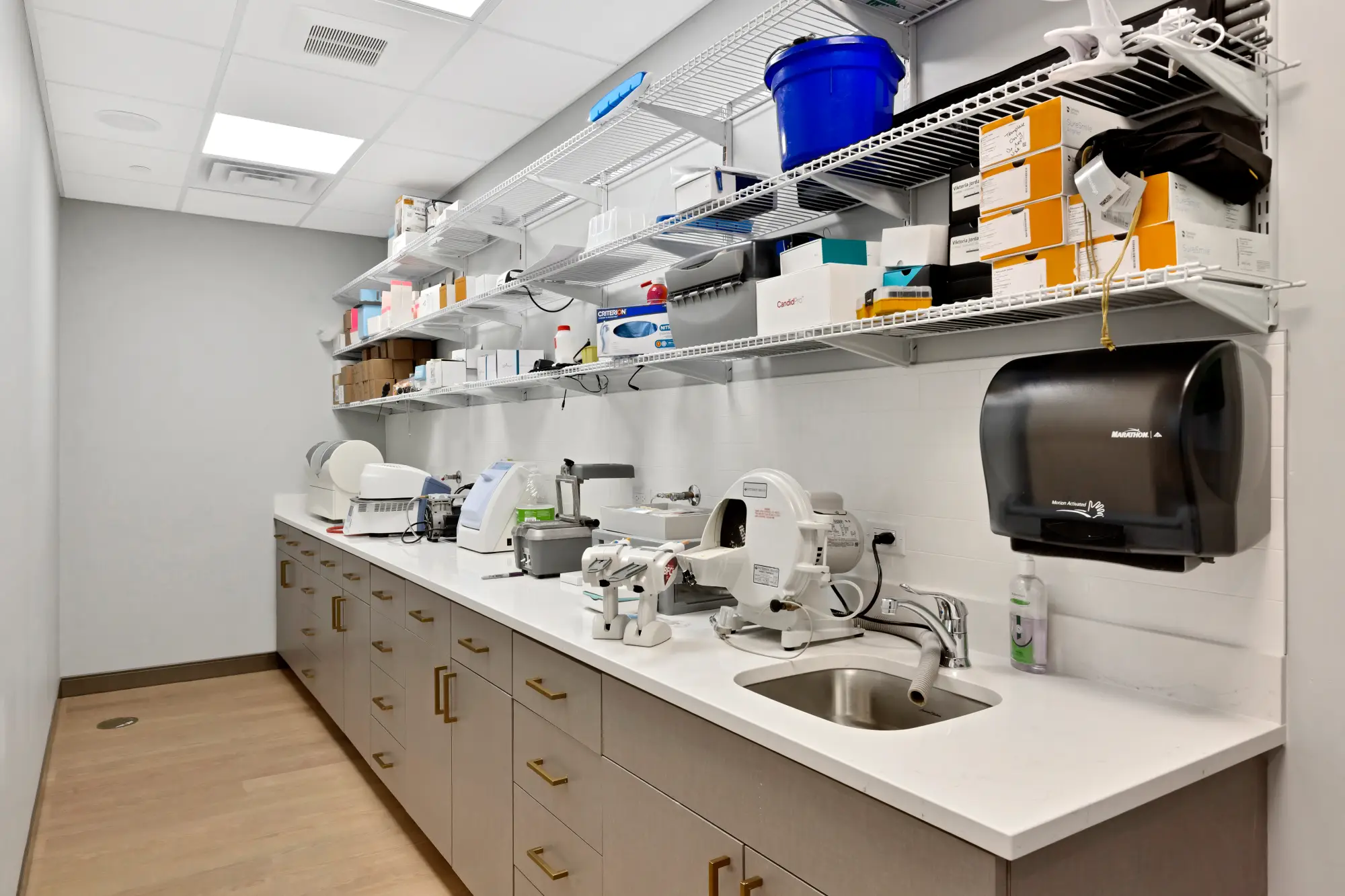 Dental lab workstation with sink, equipment and supplies