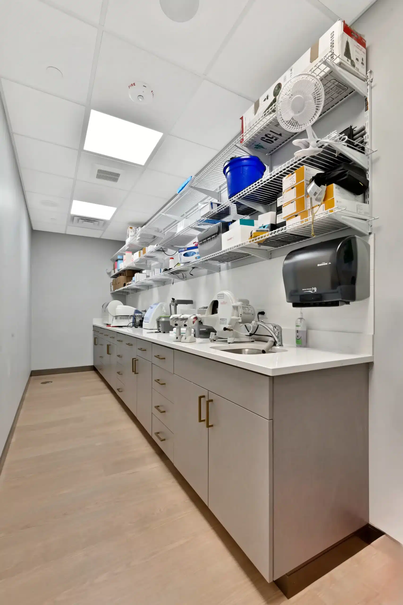 Dental lab counter with equipment and shelving