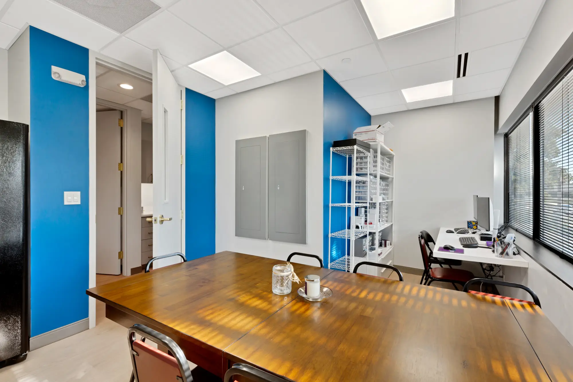 Staff break room with a wooden table and chairs